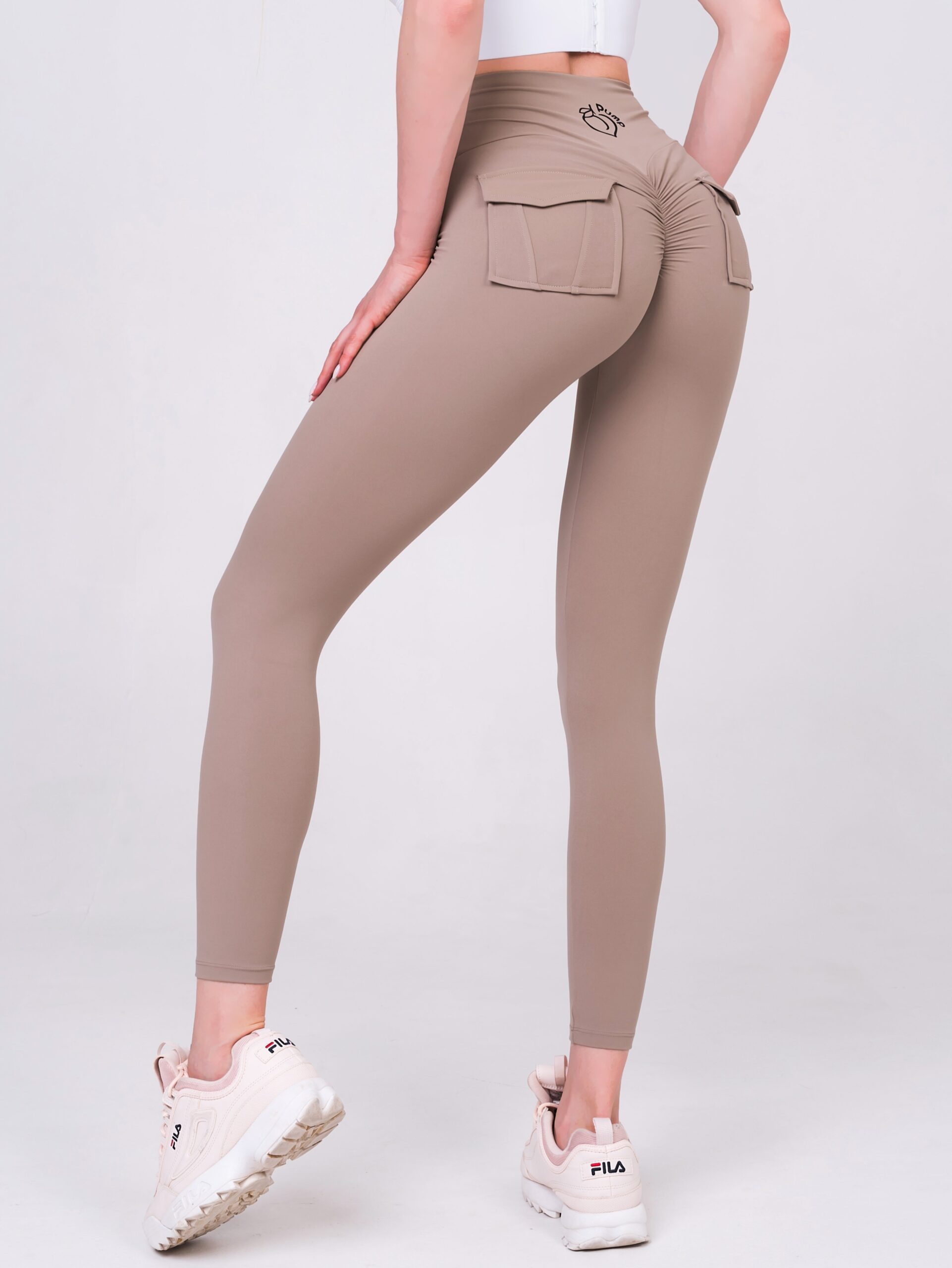 Women's sports leggings with pockets in beige color