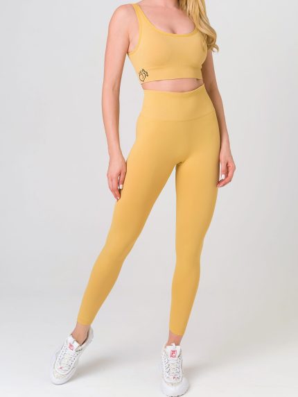 Modern sports set yellow leggings and bustier