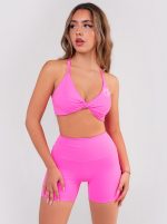 Pink two-piece sports set, short leggings and twsited bra with pads