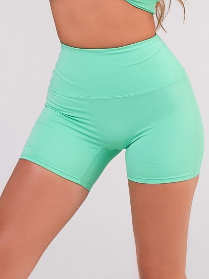 Green short leggings shaping butt