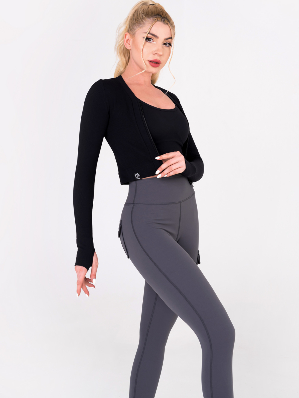 Dark grey women's leggings with three pockets, shaping effect and buckle