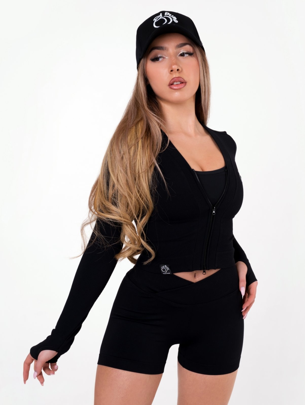 Women's sports leggings made of seamless fabric in black colour with spectacular design