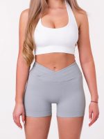 Szürke sport leggings varrásmentes anyagból, V alakú derékrésszel, varrás nélküli, légáteresztő anyagból.