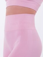 Women's sports leggings in baby pink with Peach Pump logo on the waist