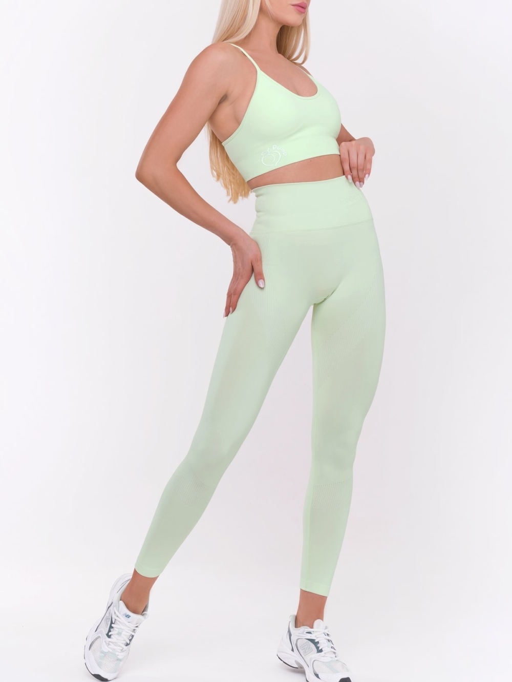 Women's two-piece sports set leggings and sports bra with padding in light green