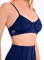 Dark blue sports bra with 3D inverted seams and push-up padding