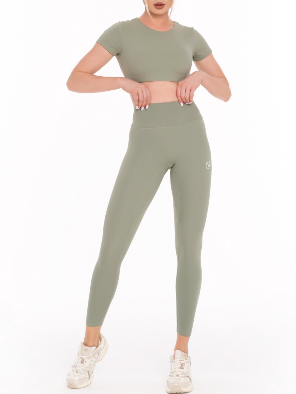 Damskie elastyczne legginsy sportowe ze średnim stanem w kolorze zielonym