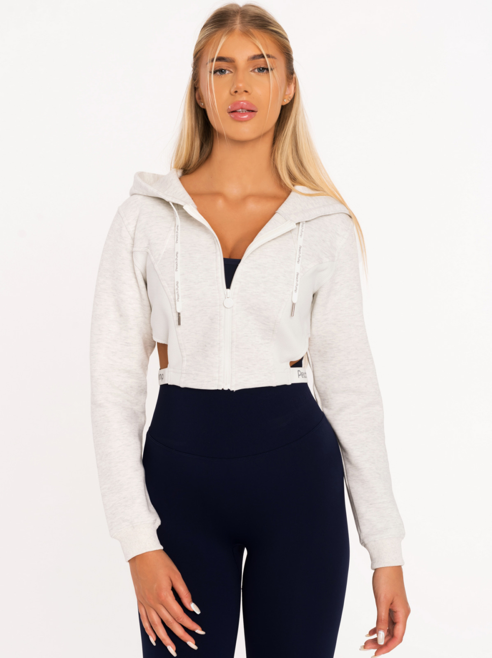 Hanorac sport în gri deschis cu detalii decupate la talie