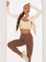 Beige sports bra with Peach Pump prints along the length