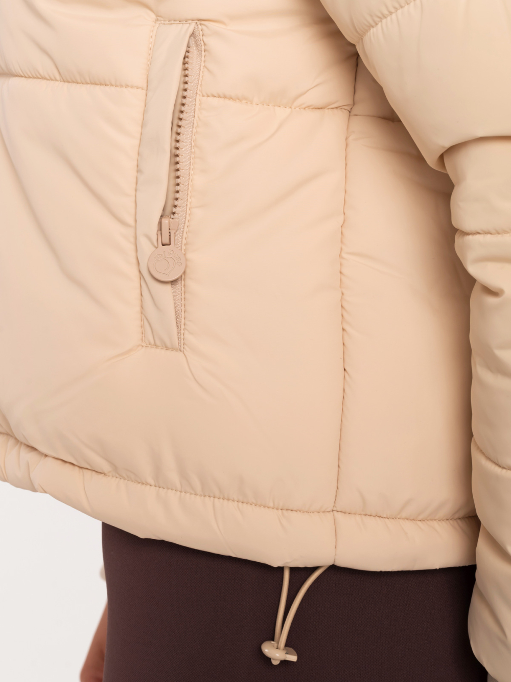 Beige women’s sporty jacket with hood and adjustable waist