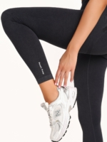 Women's black leggings made from soft stretch fabric.