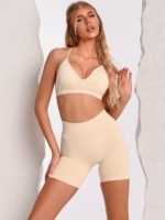Beige sports bra with a shaping effect and an adjustable back strap for a personalised fit.