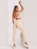 Beige leggings with Peach Pump branding and a body-hugging fit.