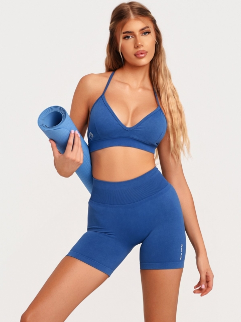 Blue sports bra with an adjustable back strap for a personalised fit.