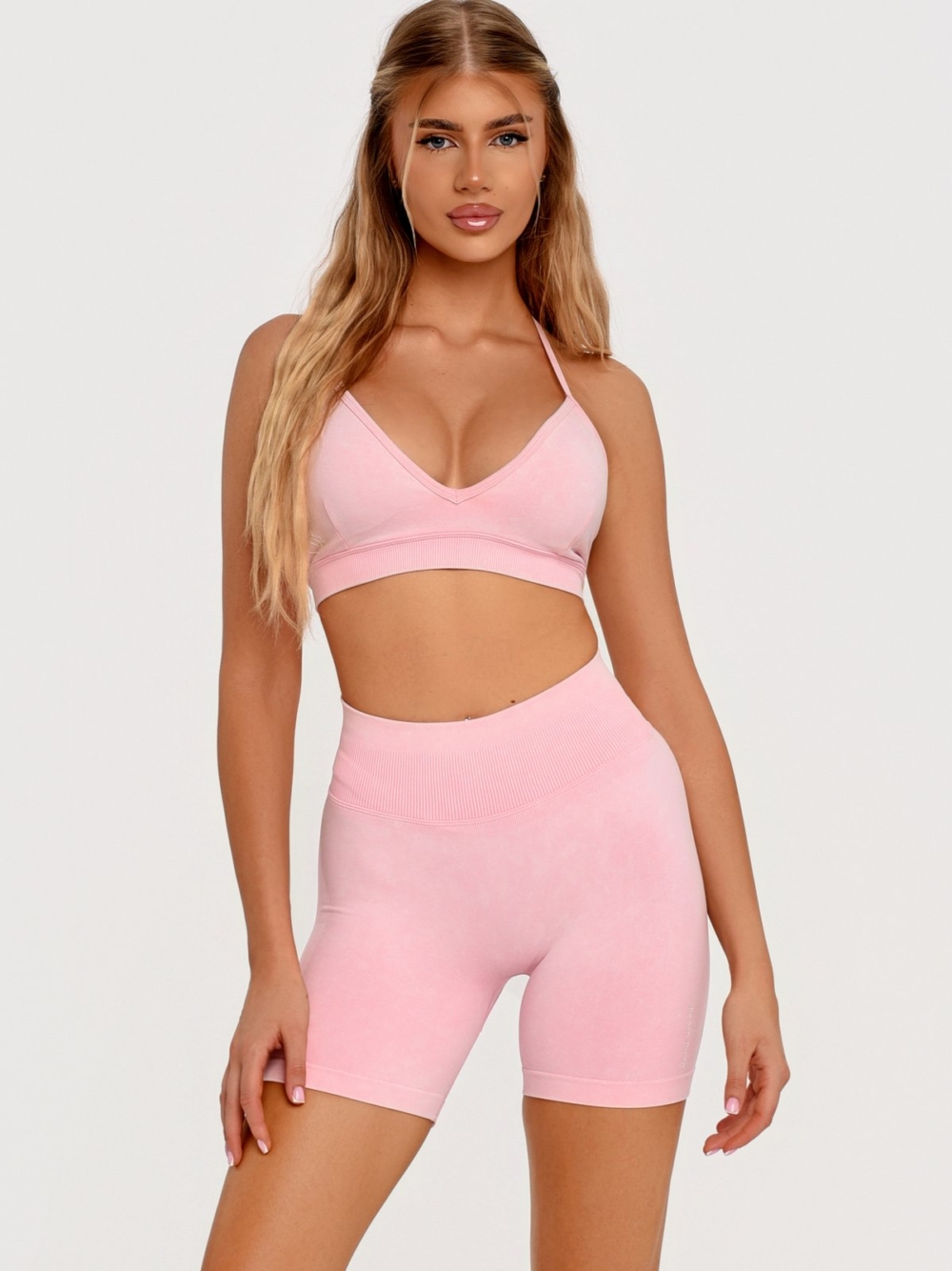 Seamless Pink Gym Shorts with a ribbed waistband that enhances the waistline.