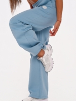 Light blue wide leg joggers with adjustable leg openings.