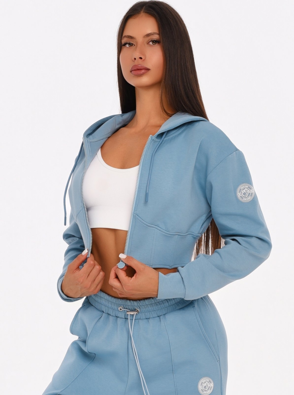 Women's light blue cropped hoodie with a feminine corset-inspired fit.