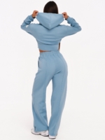 Light blue gym set with adjustable wide leg joggers and elastic waistband.