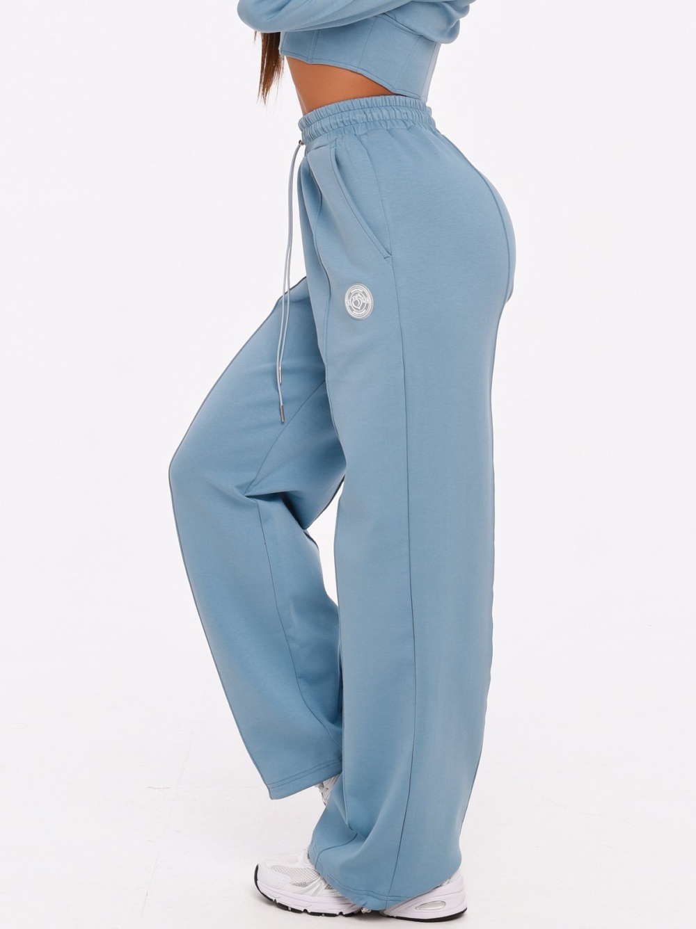 Light blue wide leg joggers by Peach Pump for workouts and everyday wear.