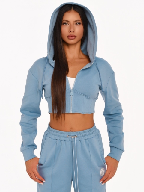 Light blue cropped hoodie with a feminine corset-inspired silhouette.