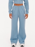 Women's light blue wide leg joggers made from soft cotton-blend fabric.