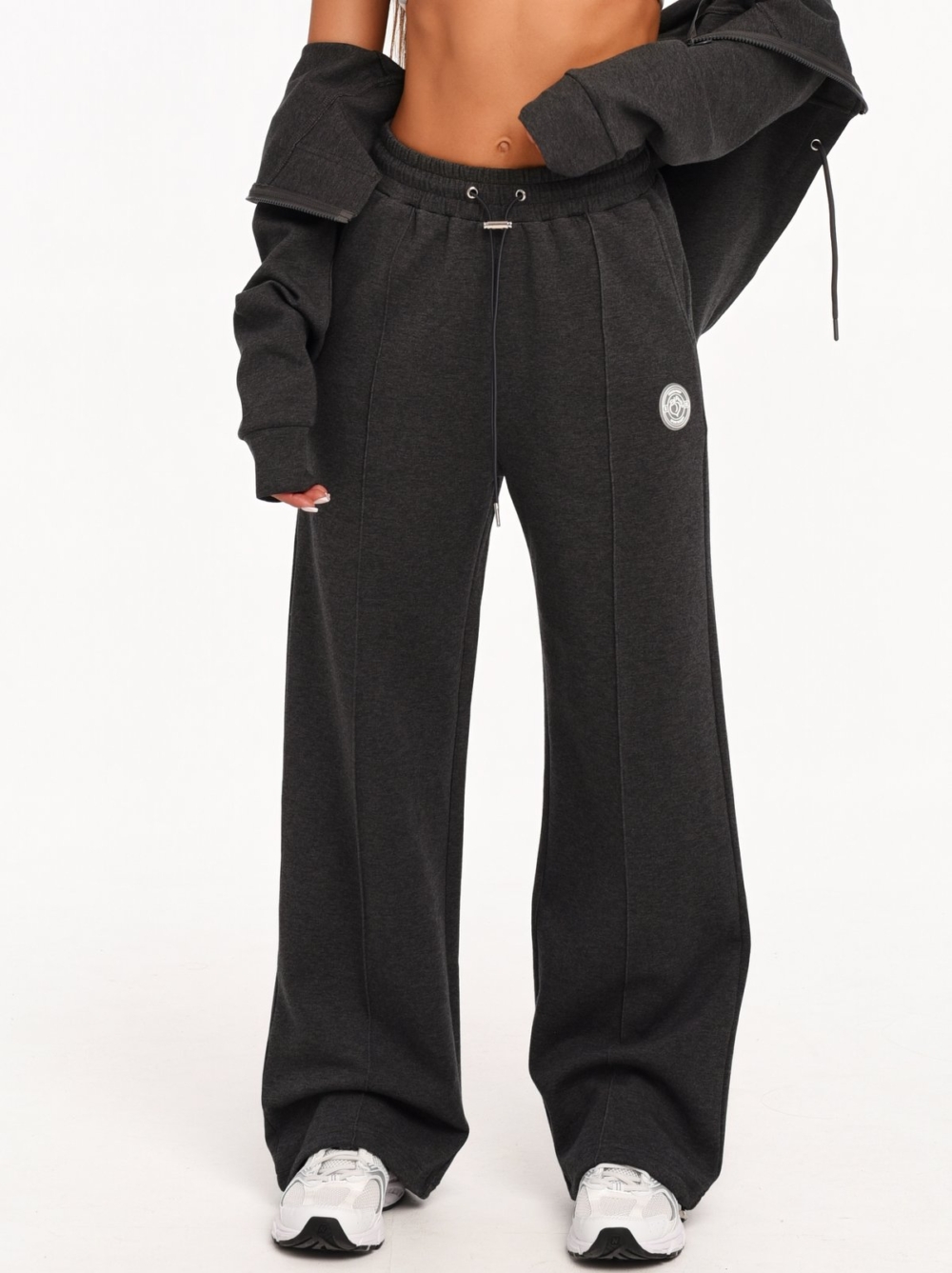 Women's black wide leg joggers made from soft cotton-blend fabric.
