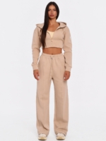 Women's beige gym set with adjustable wide leg joggers.