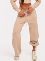 Women's beige wide leg joggers with a modern relaxed silhouette.