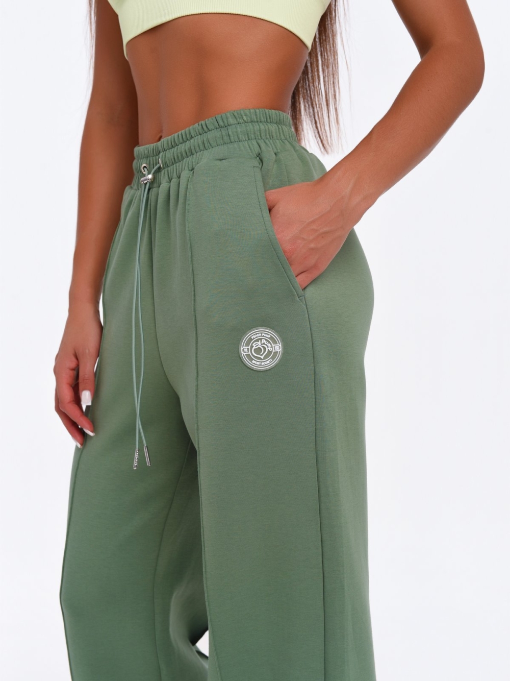 Women's green wide leg joggers with a modern Wide Leg fit.