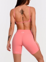 Korallrosa Fitness-Bustier mit Super Push-Up-Effekt für eine schön geformte Brust.