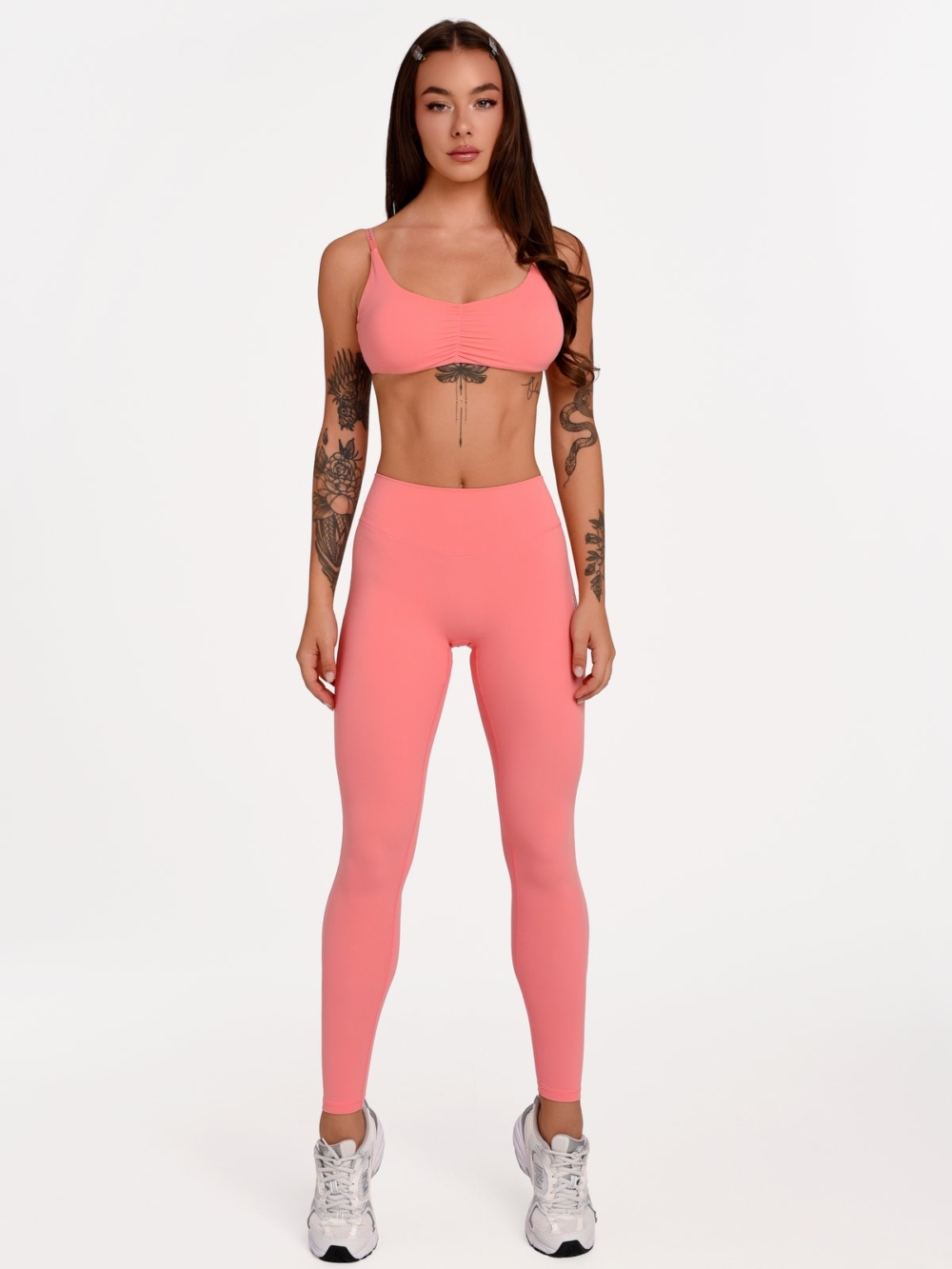 Lange korallenrosa Fitnessleggings für Damen aus weichem Material mit hervorragender Elastizität.