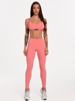 Lange korallenrosa Fitnessleggings für Damen aus weichem Material mit hervorragender Elastizität.