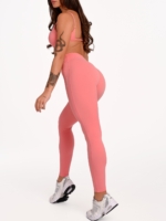 Lange korallenrosa Sportleggings für Damen mit hochwertigen und präzise verarbeiteten Nähten.