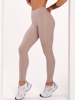 Women's beige sports leggings with a mid-rise waist and Invisible Scrunch.