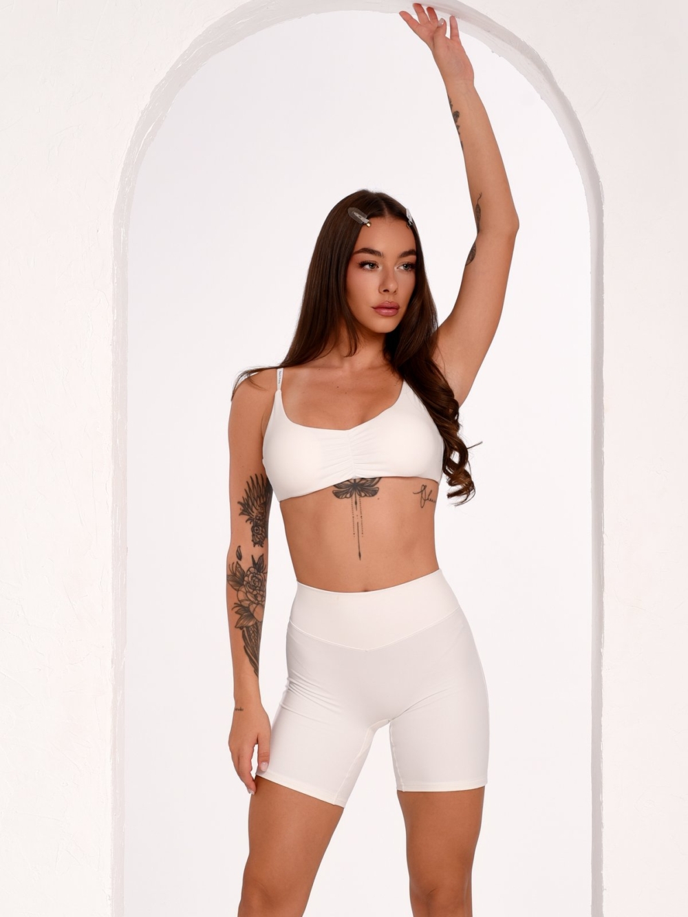 Women's Off-White Short Workout Leggings with a Mid-Rise Waist and Shaping Effect.