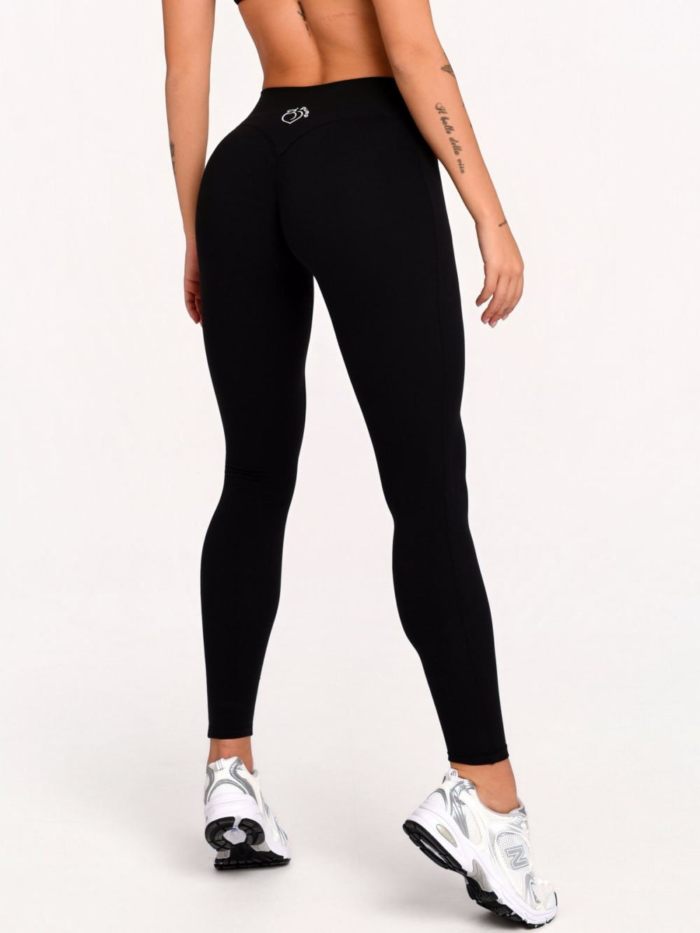 Women's black sports leggings with a mid-rise waist and Invisible Scrunch.