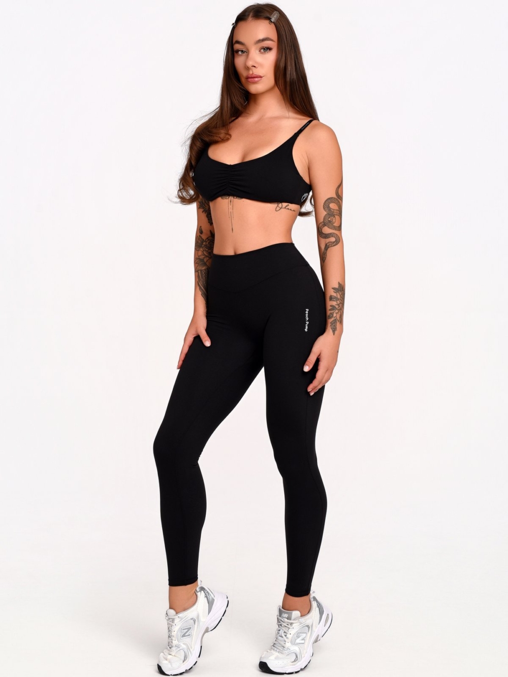 Women's black full-length leggings made from soft, stretchy fabric for maximum freedom of movement.