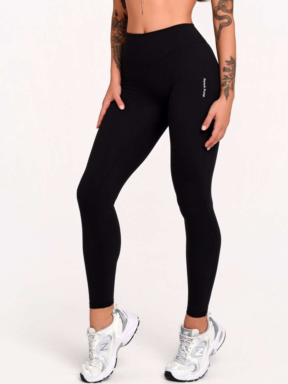 Women's black sports leggings with a discreet Invisible Scrunch and shaping effect.